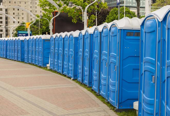 a line of portable restrooms at a sporting event, providing athletes and spectators with clean and accessible facilities in Alton, IL